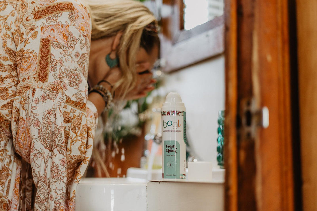 women at sink washing face with bogl's fresh + clean face wash for combination skin