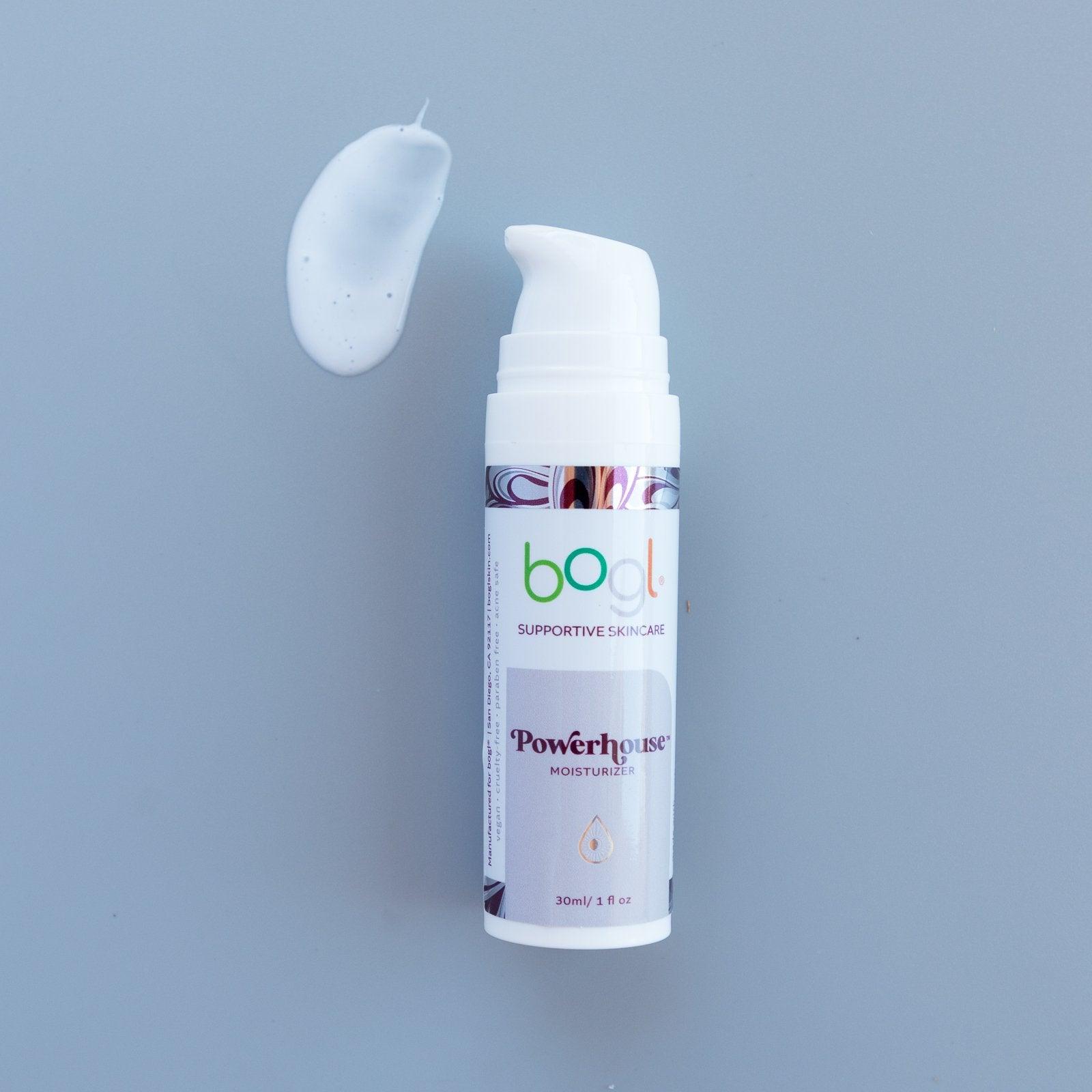 bogl's powerhouse copper peptide moisturizer light blue product smear for age management on blue background in 1 oz bottle