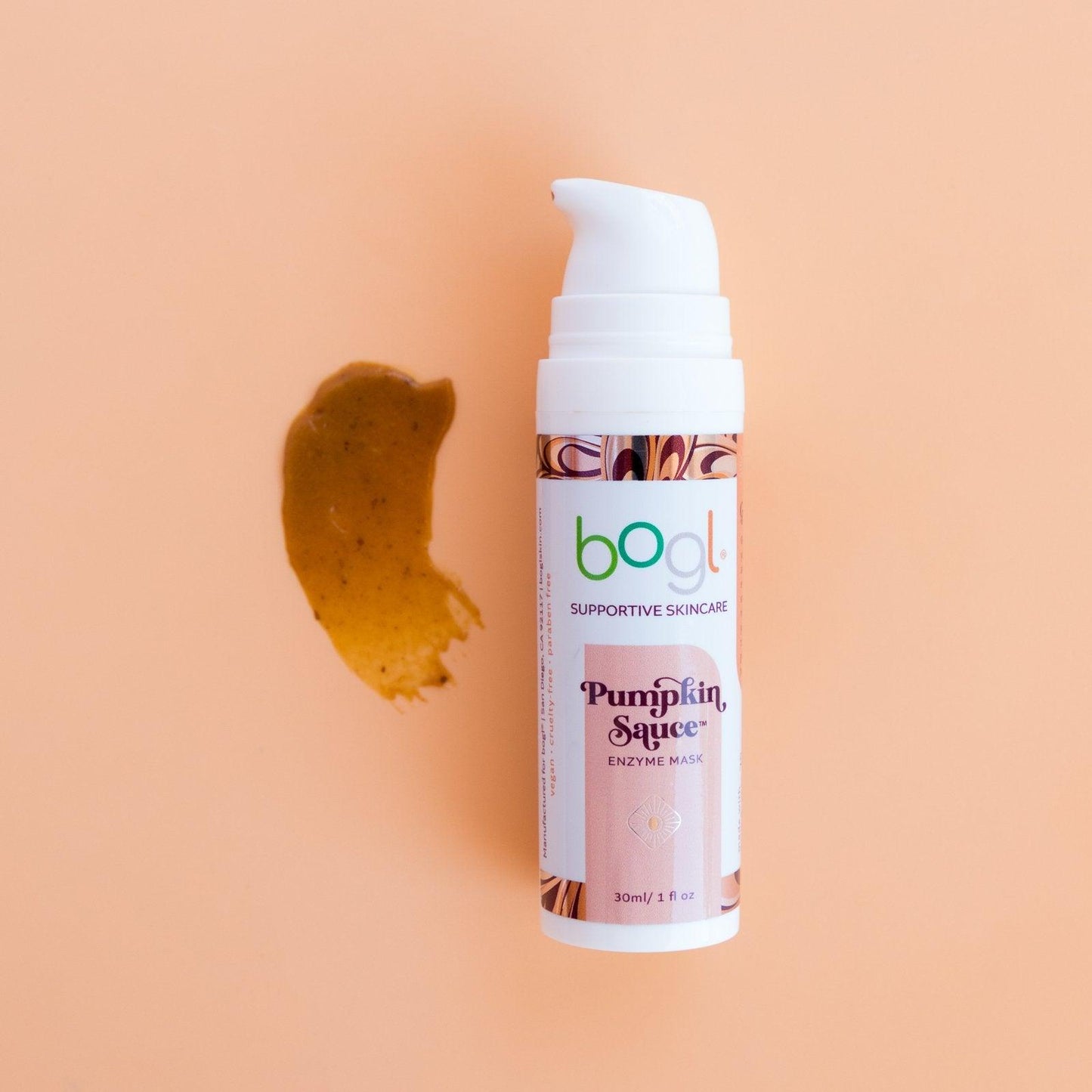 bogl's pumpkin enzyme mask dark orange product smear on light orange background for radiant skin 1oz in bottle